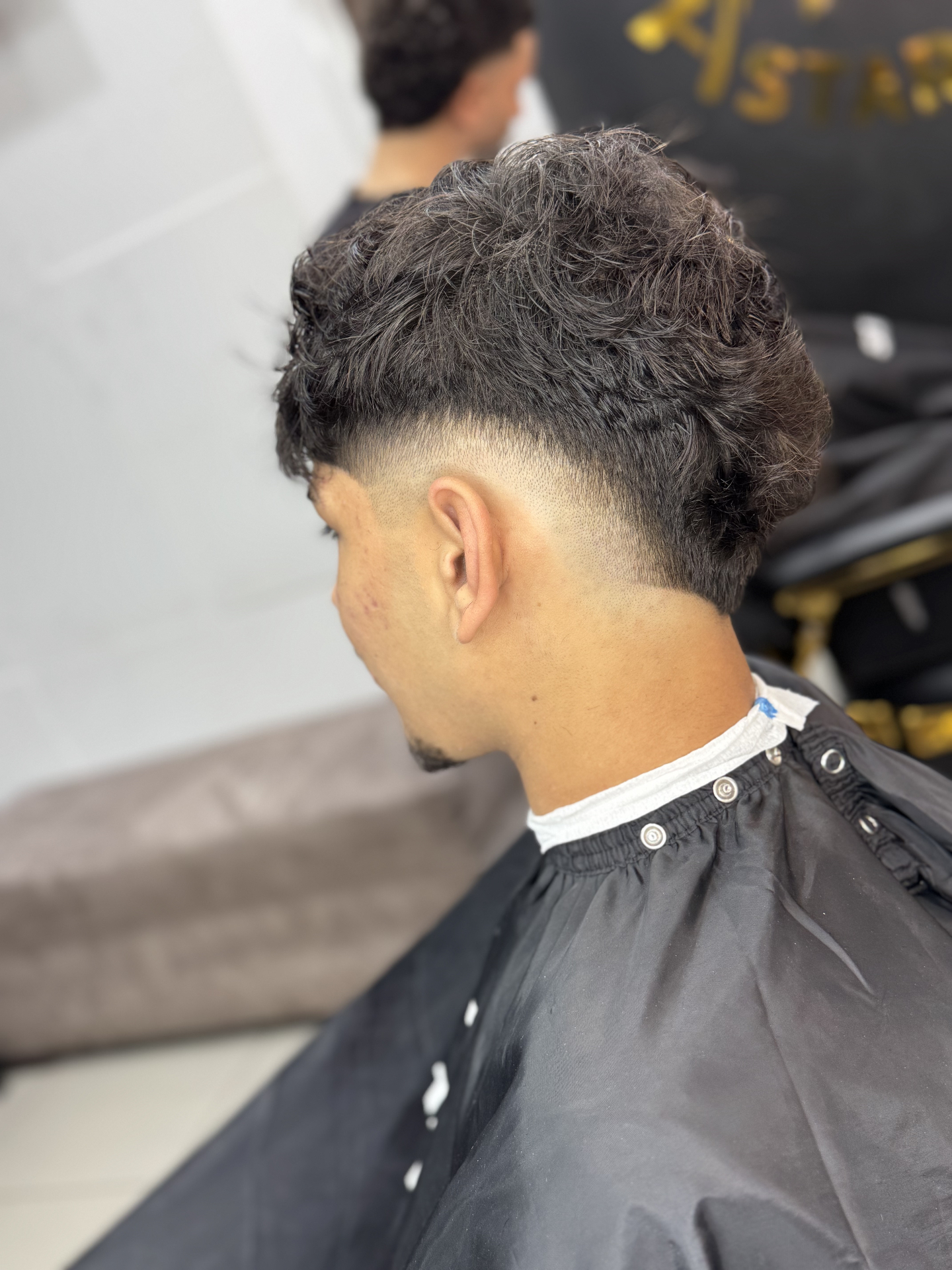 Skin fade with sharp line-up at A Star Fades barbershop