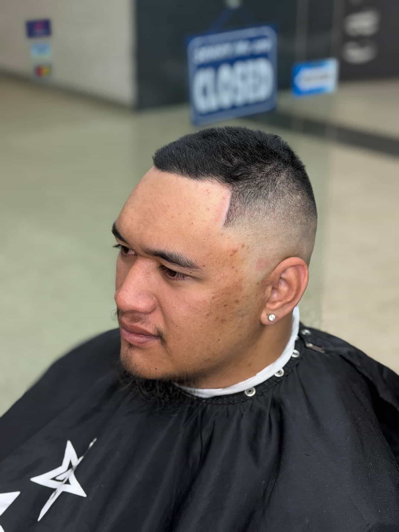 Modern fringe haircut with blended fade